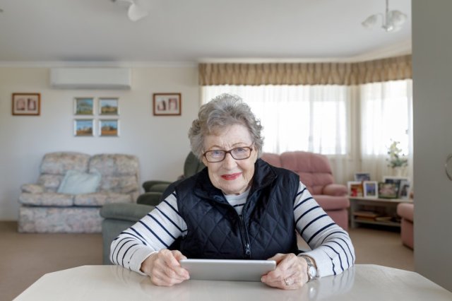 Senior Australian Woman Learning To Use Digital Tablet