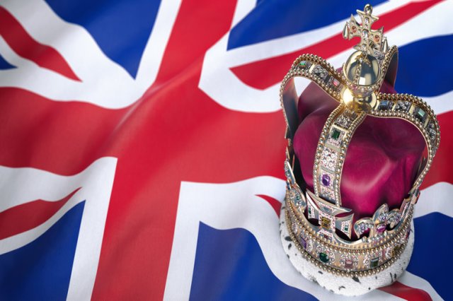 Royal golden crown with jewels on british flag. Symbols of UK United Kingdom.