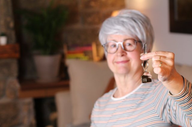 Senior woman holding house keys