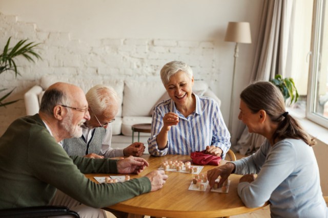 group-of-four-cheerful-senior-people-two-men-and-two-women-having-fun-picture-id1286546794