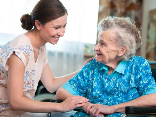 senior-woman-with-home-caregiver-picture-id467579823-1