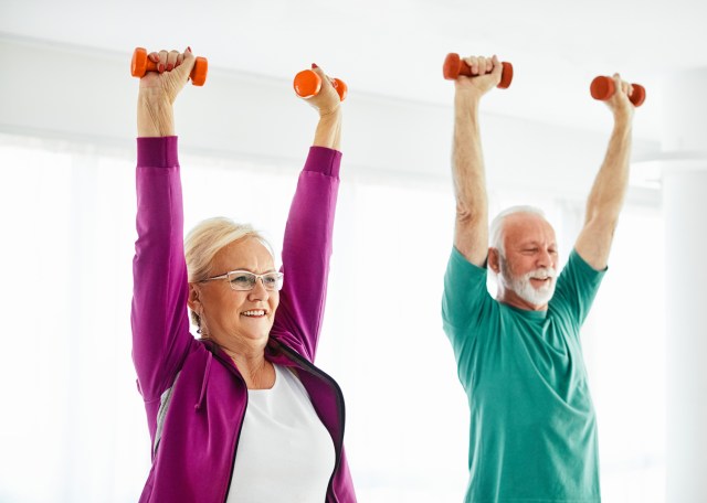 couple exercising strength class