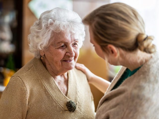 iStock-1307432596 Health visitor talking to a senior woman during home visit