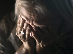 Depressed Senior Woman Alone In The Dark - Sadness, Mental Health, Negativity