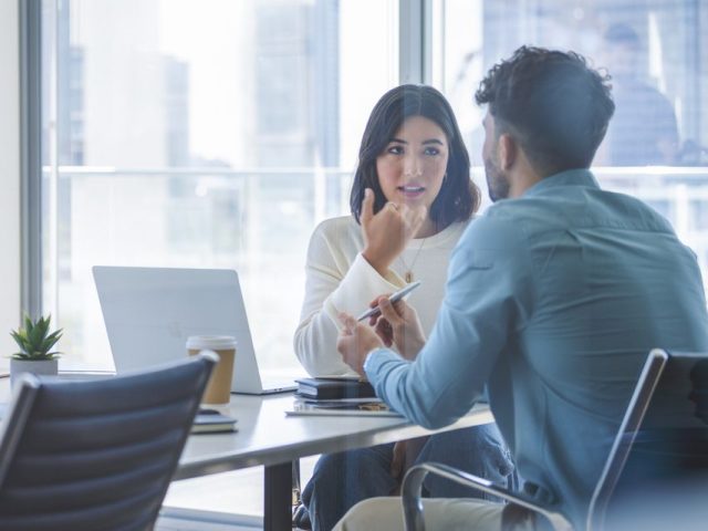 Business woman and man meeting and talking