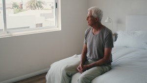 Thinking, bed and senior man with retirement, sad and anxiety with depression, home and memory with Alzheimer. Old person, pensioner or elderly guy with stress, bedroom or remember with mental health
